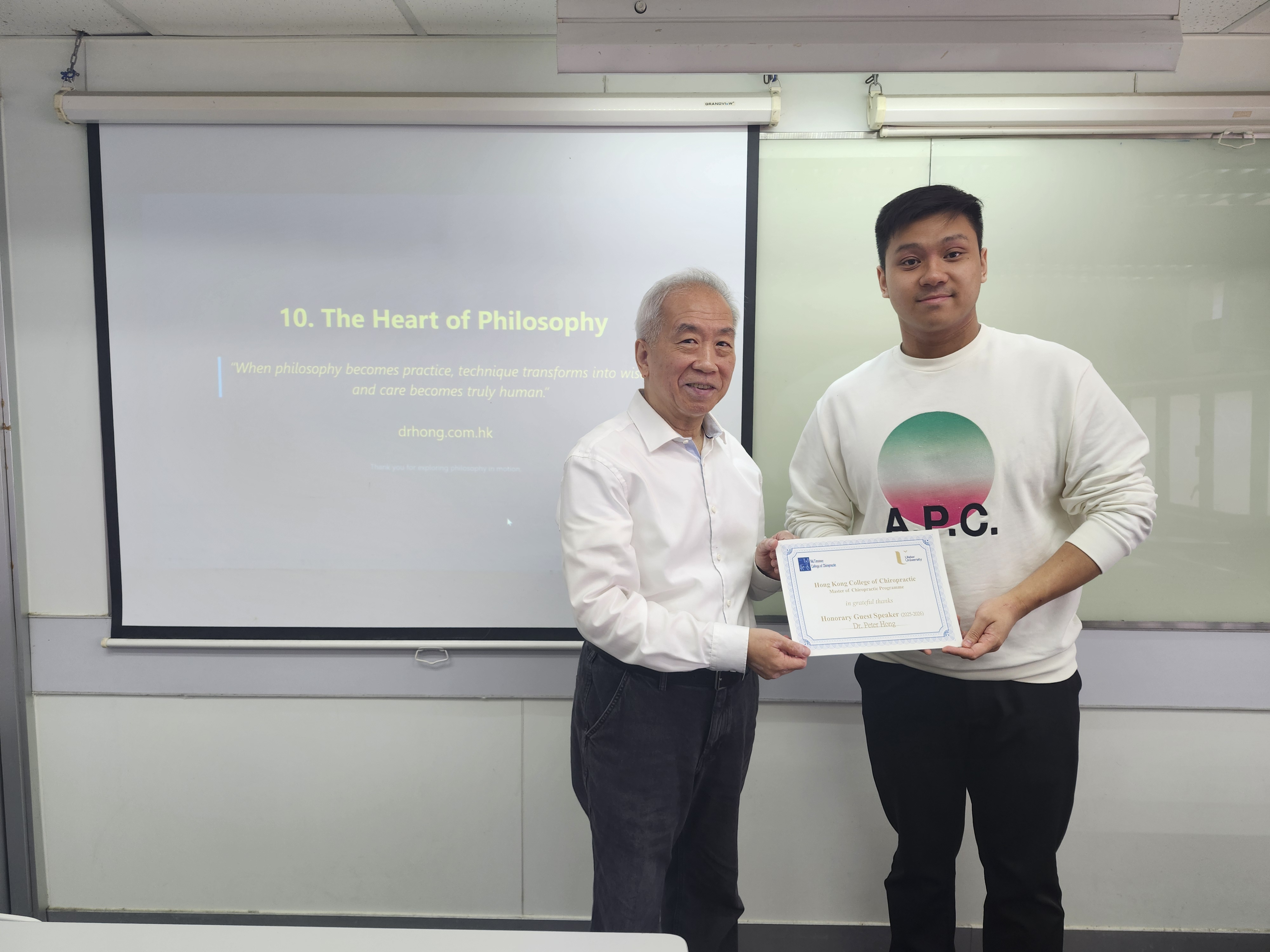 Dr. Robert Kwok granting the certificate